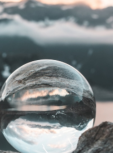 Reflection of moutain in glass ball